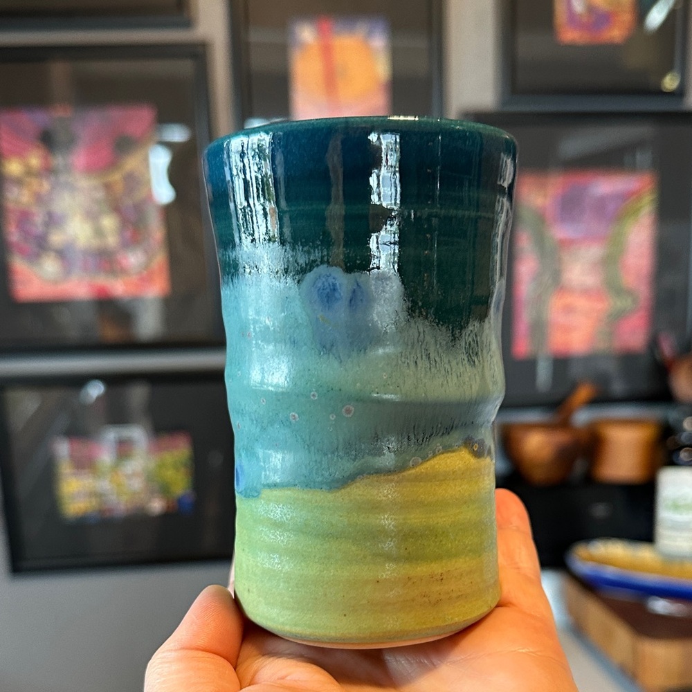 Handmade signed pottery cup in blues and greens. Unique artisan boho hippie gift